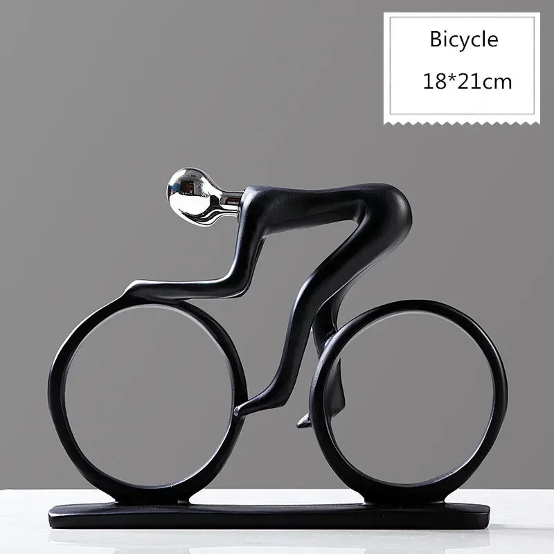 Black bicycle-shaped decorative object on a gray background