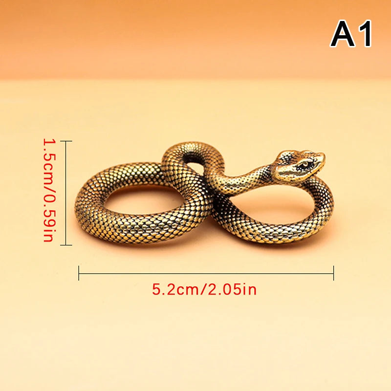 Gold snake-shaped ring with measurements on a beige background