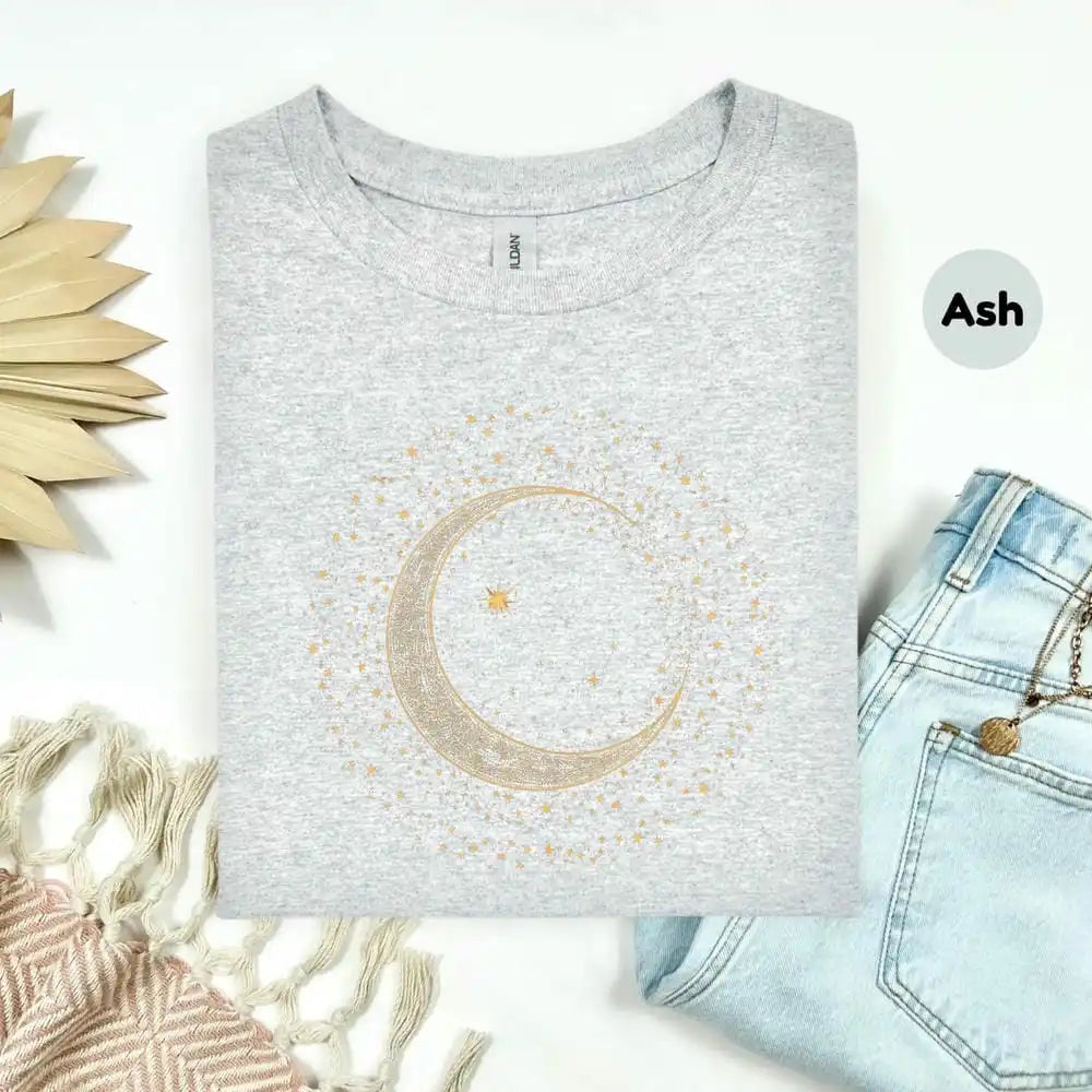 Gray t-shirt with a gold moon design on a white background