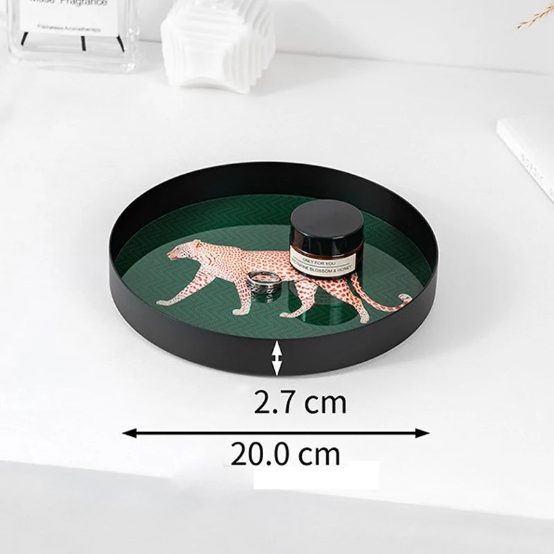 Round decorative tray with a leopard design on a white surface