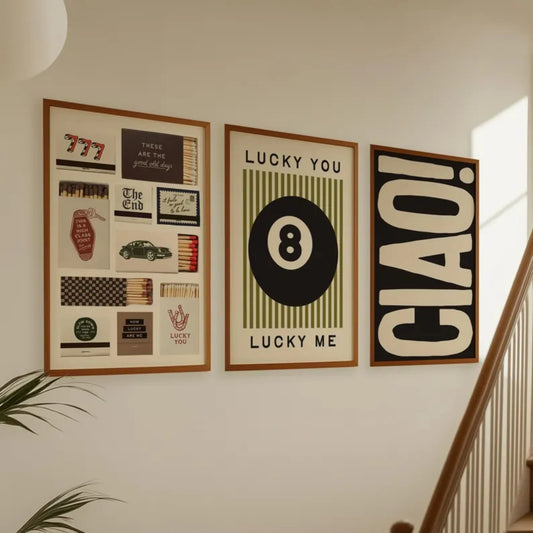 Set of three modern wall art prints featuring 8 ball, typography and graphic design displayed in a living room setting