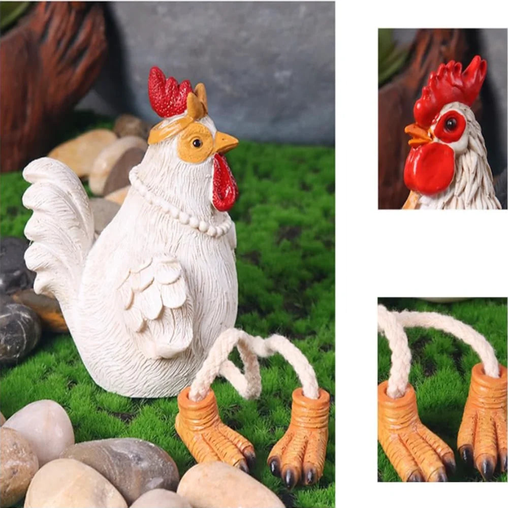 Decorative chicken figurine with red comb on grass