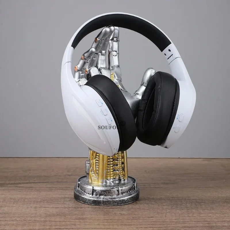 White and black headphones on a transparent stand with visible wiring against a gray background