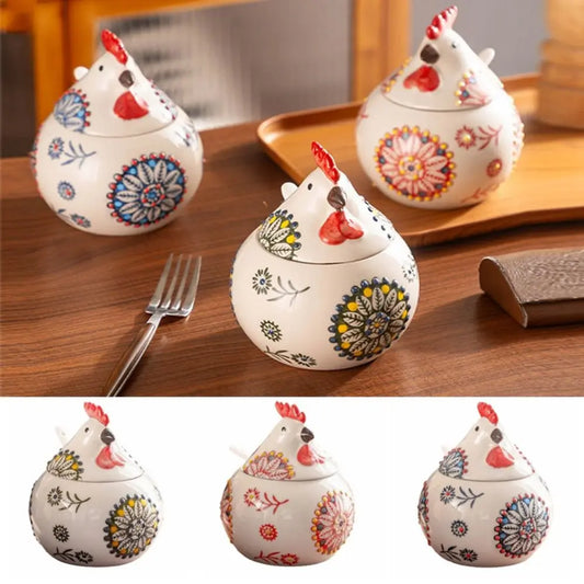 Decorative ceramic chicken-shaped containers with floral patterns on a wooden surface.