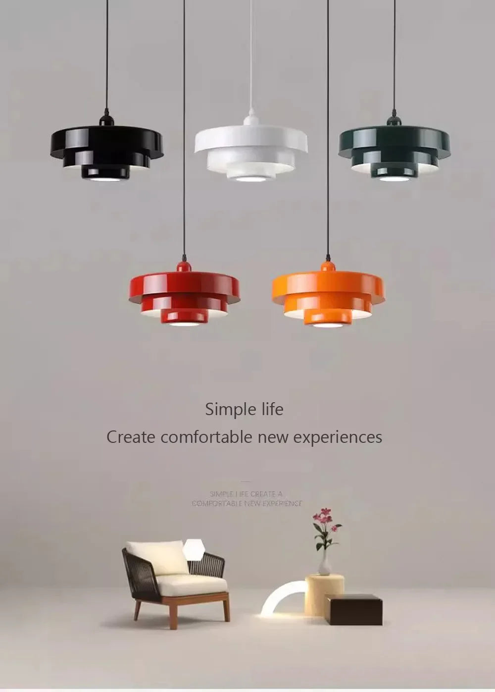 Modern pendant lights in black, white, red, and orange hanging above a minimalistic interior with a chair and plant.
