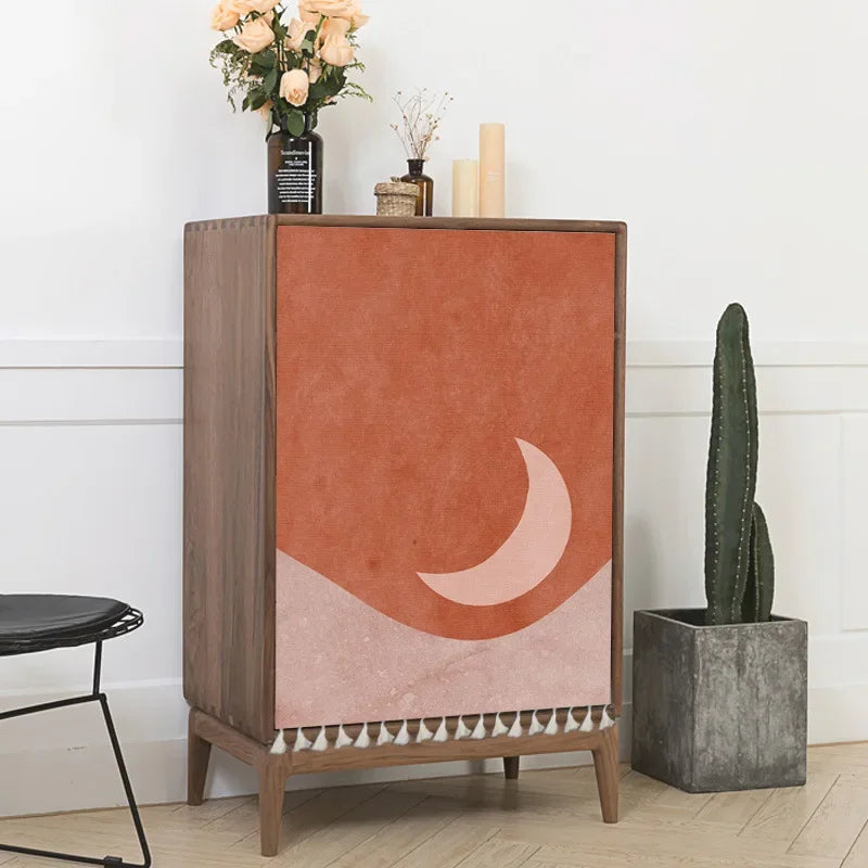 Cabinet with a decorative design on a white wall background