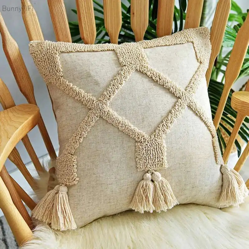 Boho Decorative pillow with tassels on a wooden chair