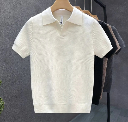 Men’s short sleeve knit polo shirt in slim fit style hanging on a rack in neutral colours