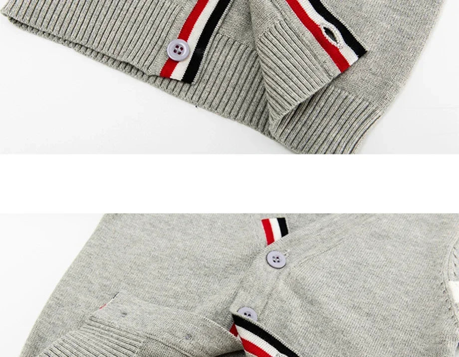 Gray sweater with striped cuffs and collar on a white background