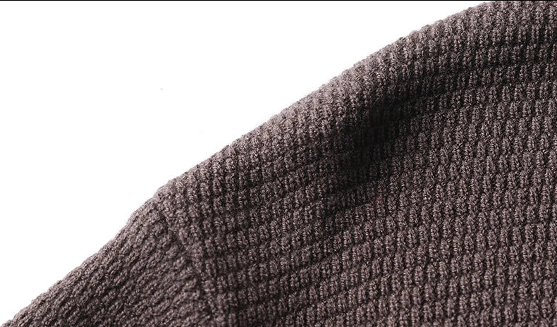 Close-up of a sleeve on a textured brown fabric  