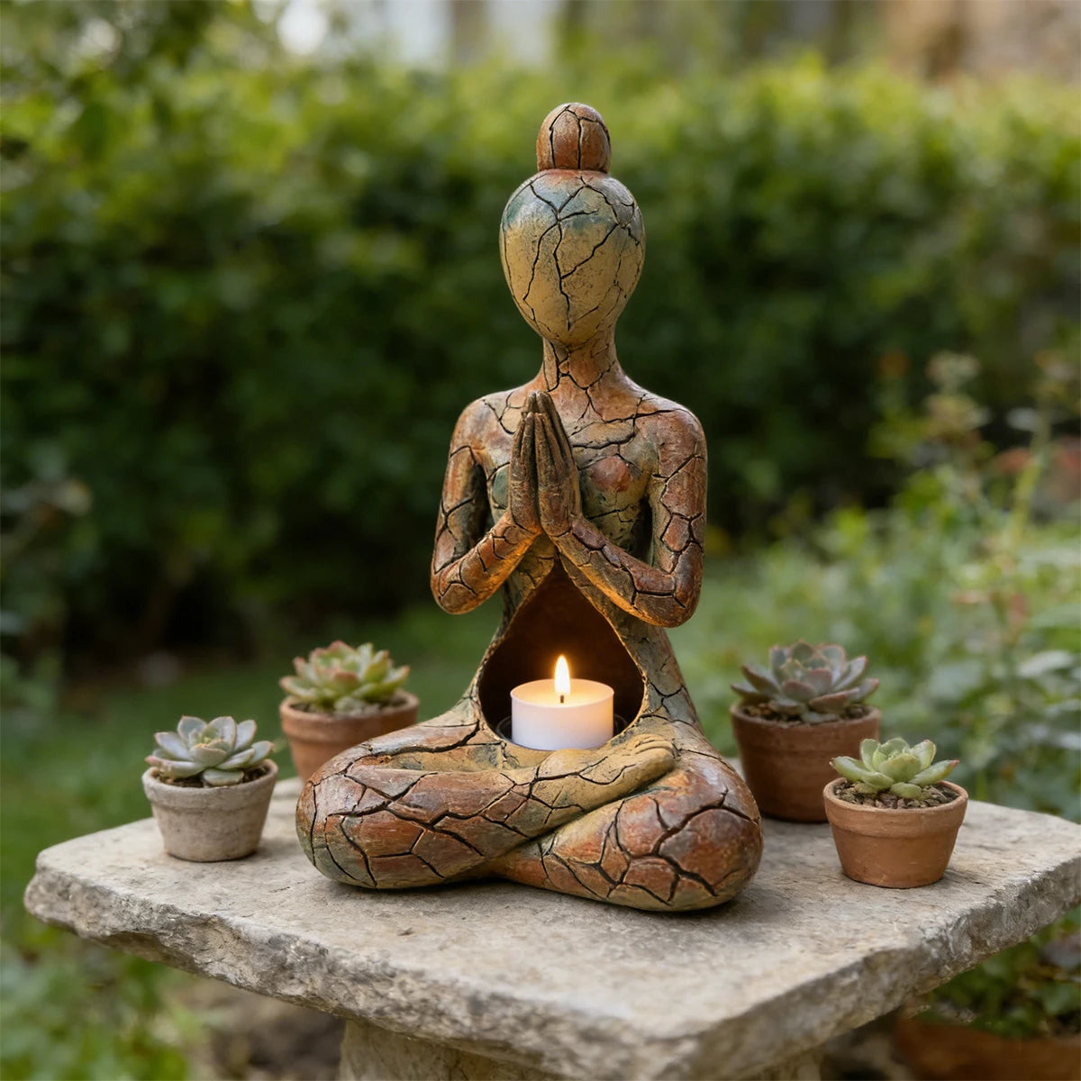 Artistic resin meditating figure ornament with a warm cracked-effect finish and hollow centre designed for a flameless LED candle.