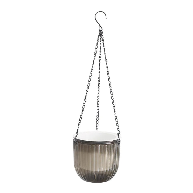 Hanging planter with ribbed design and chain on a white background