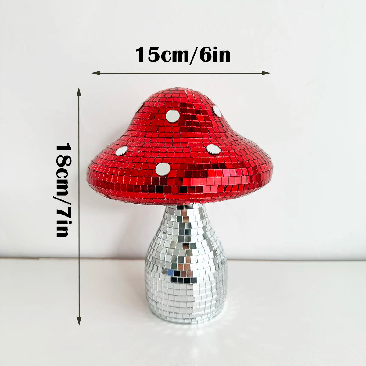 Red and silver disco mushroom with measurements on a white background