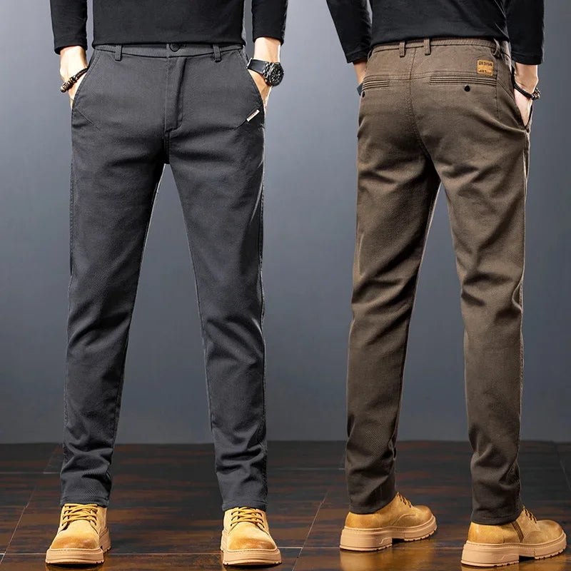 Two pairs of pants displayed side by side on a gray background