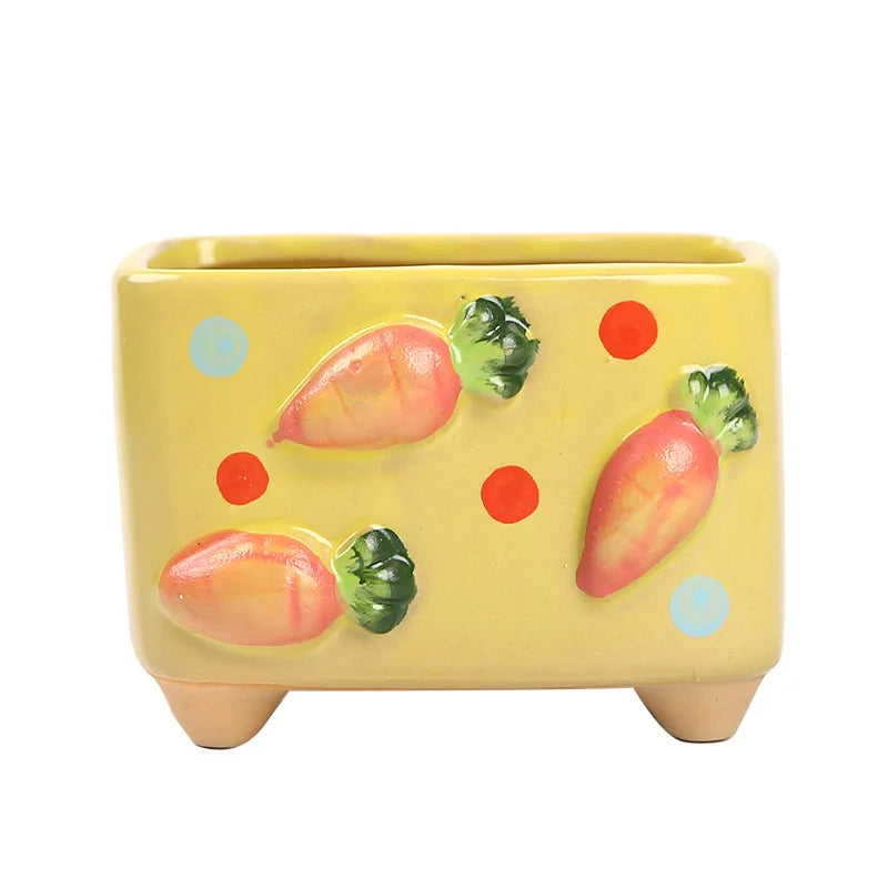 Yellow rectangular planter with colorful fruit designs on a white background