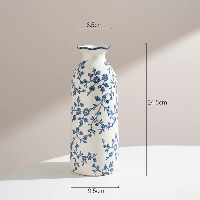 Ceramic vase with blue floral patterns on a beige background