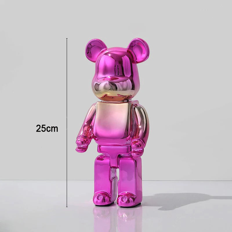 Pink and gold bear-like figure with measurement label on a white background