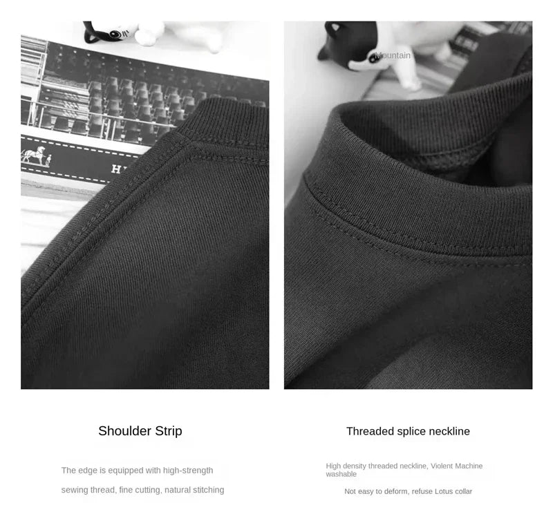 Close-up of black clothing with shoulder strip and threaded splice neckline details.