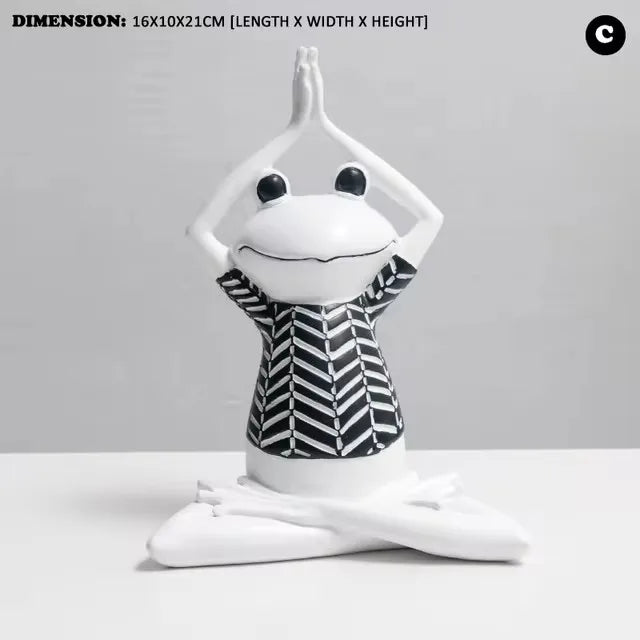Frog Yoga Figurine with black and white striped shirt on a gray background