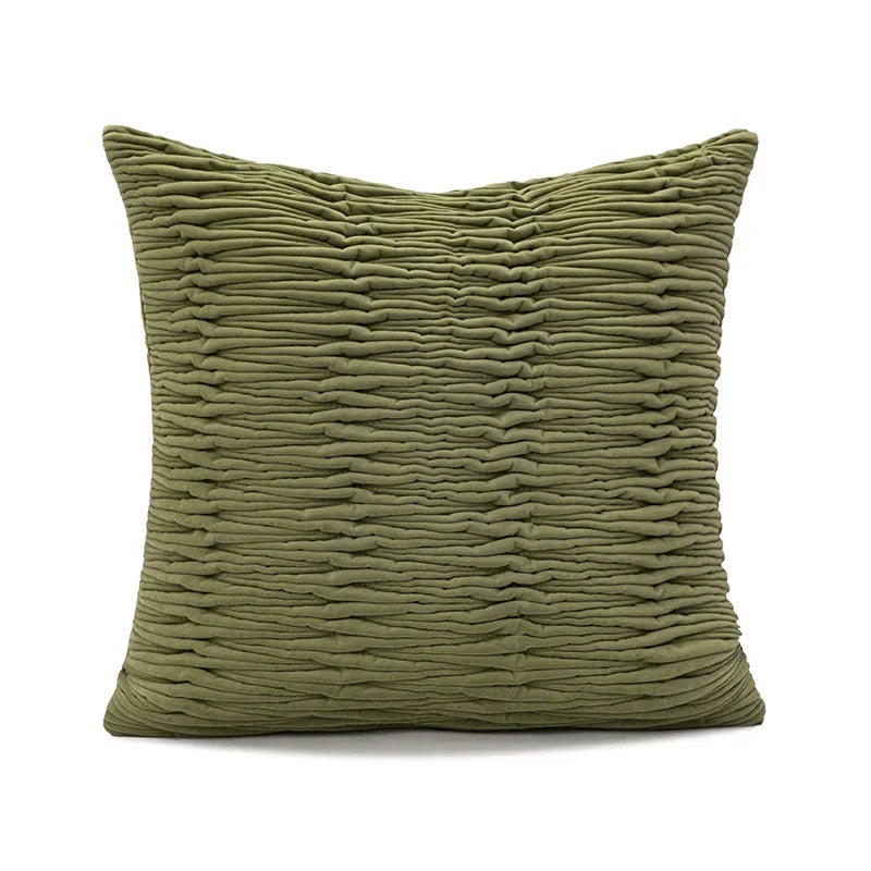Textured green pillow on a white background