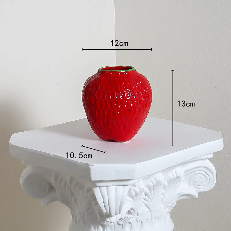Red textured vase on a white pedestal with measurements indicated