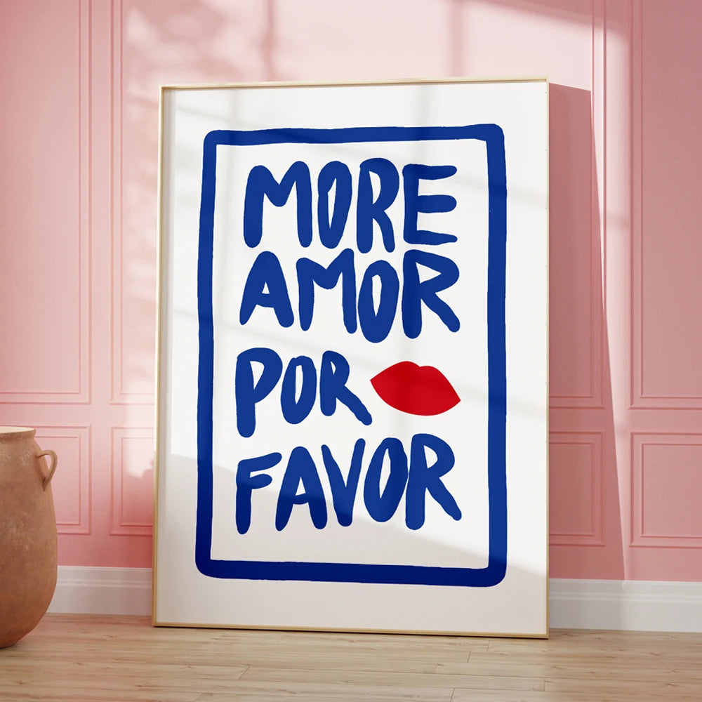 Framed artwork with 'More Amor Por Favor' text on a pink wall.