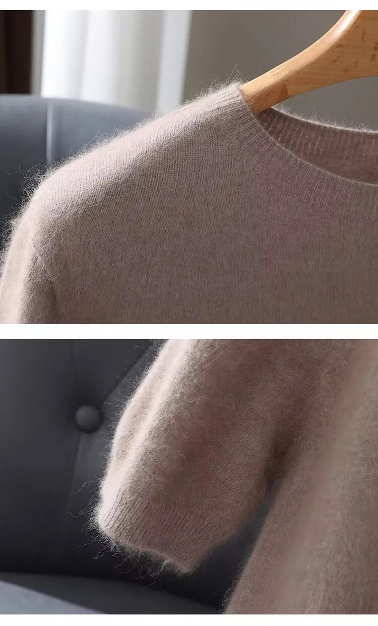 Close-up of a beige sweater on a hanger with a blurred background