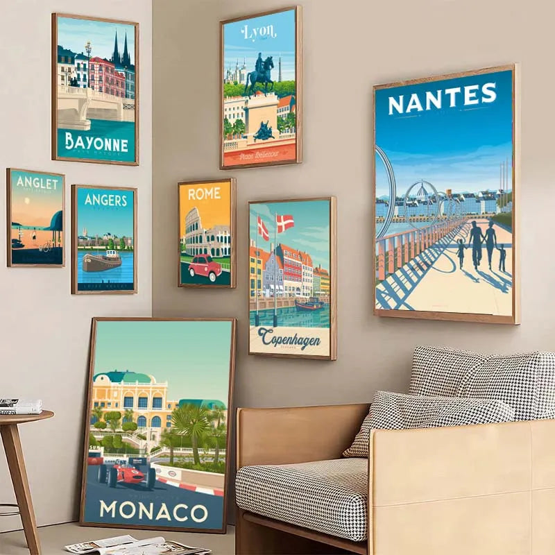 Collection of framed posters of cities like Bayonne, Lyon, Nantes, Anglet, Angers, Rome, Copenhagen, and Monaco on a wall.