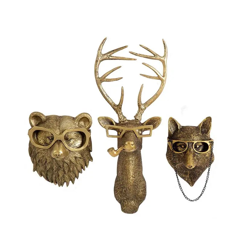 Three decorative animal heads with glasses and accessories on a white background
