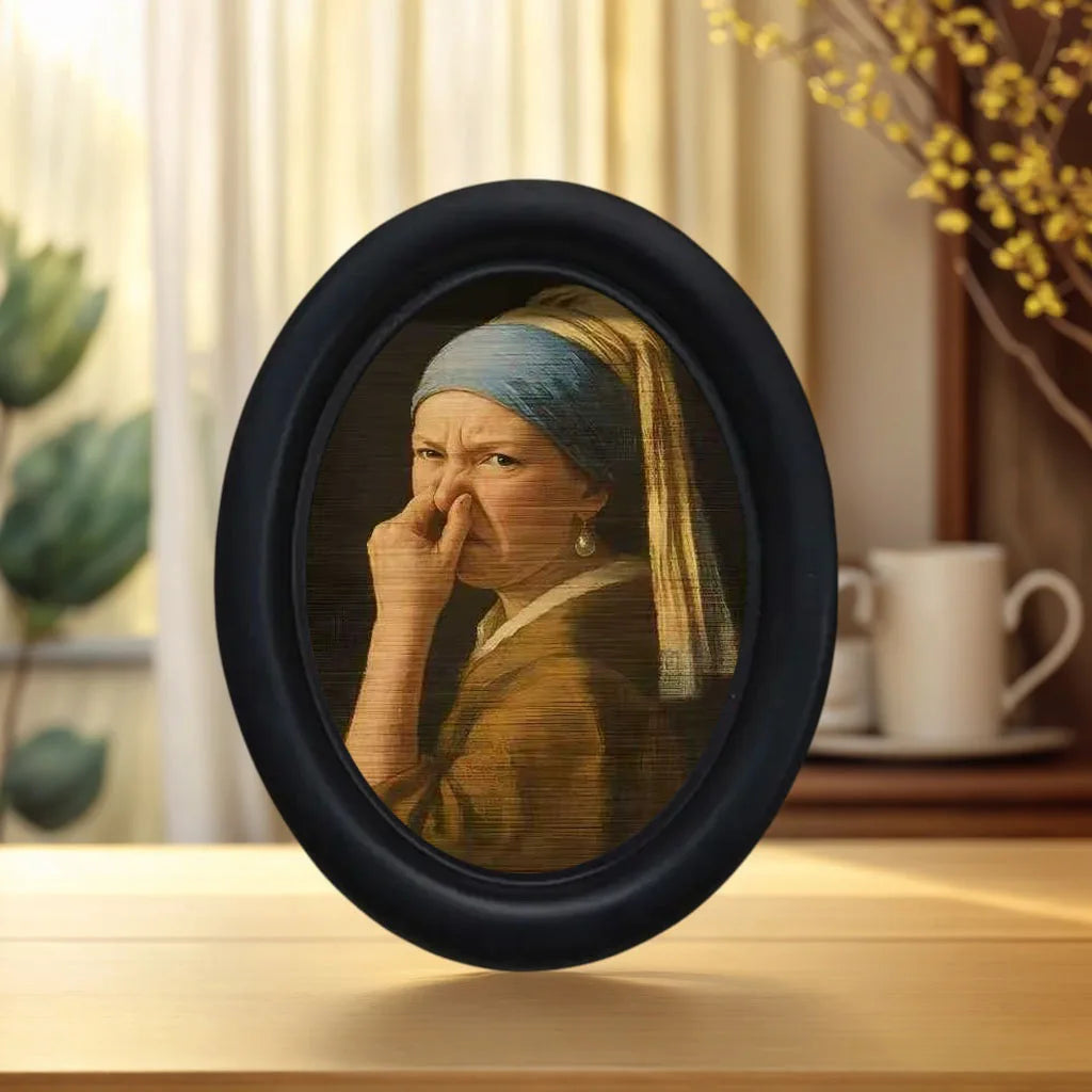 Small framed parody artwork featuring a humorous expression in a black oval frame, designed as quirky bathroom and home wall décor.
