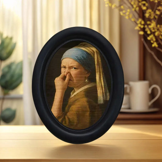 Small framed parody artwork featuring a humorous expression in a black oval frame, designed as quirky bathroom and home wall décor.
