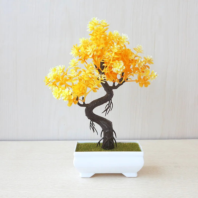 Bonsai tree with yellow leaves in a white pot on a light background