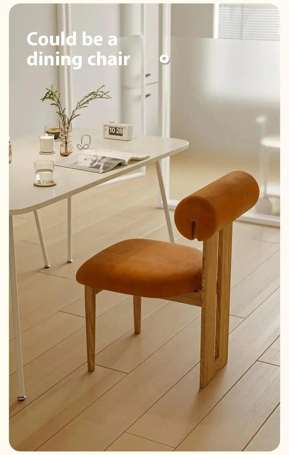 Brown chair in a room with a table and decor items.