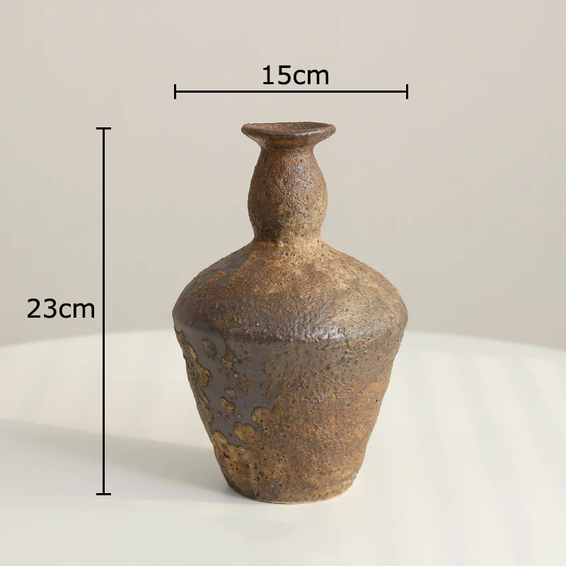 Brown ceramic vase with measurements on a light background