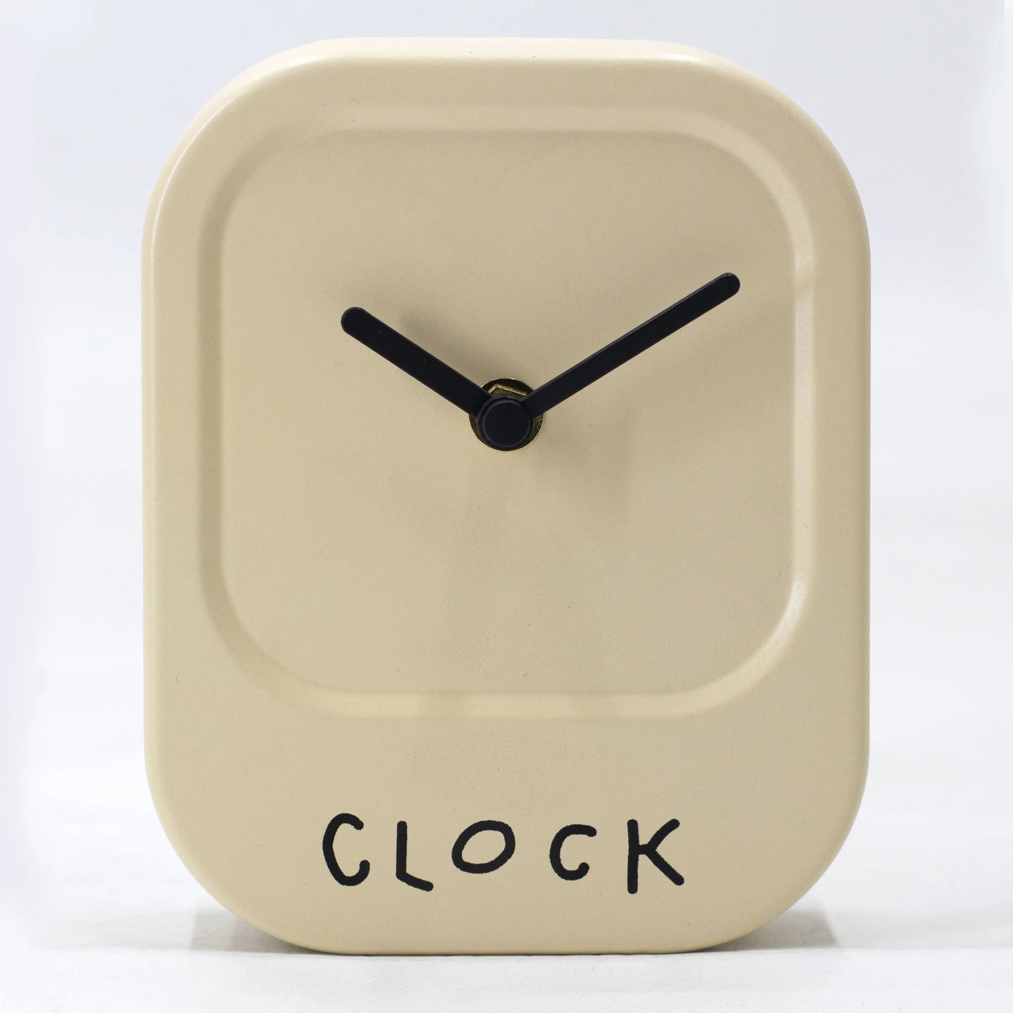 Beige square clock with black hands and 'CLOCK' text on a white background