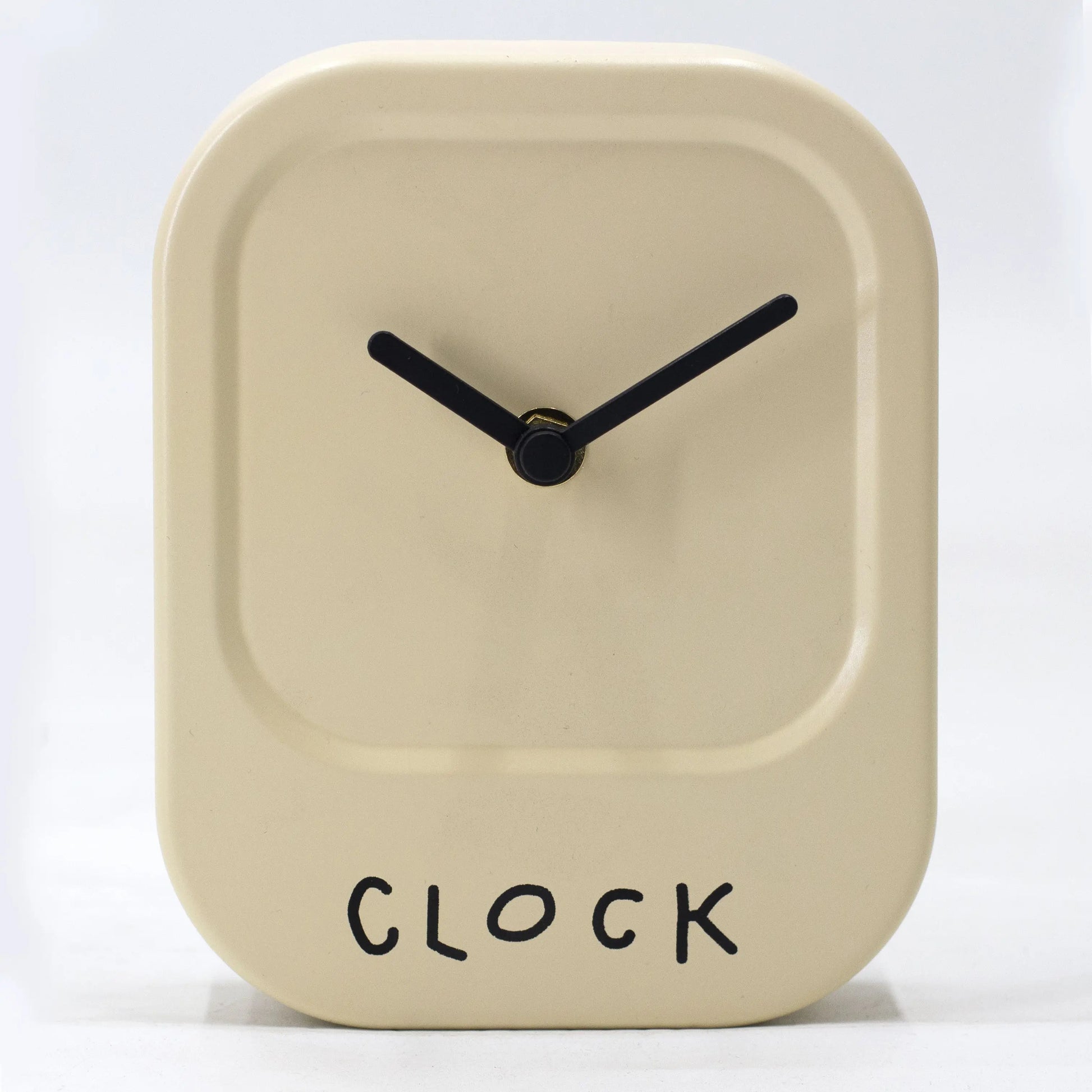 Beige square clock with black hands and 'CLOCK' text on a white background