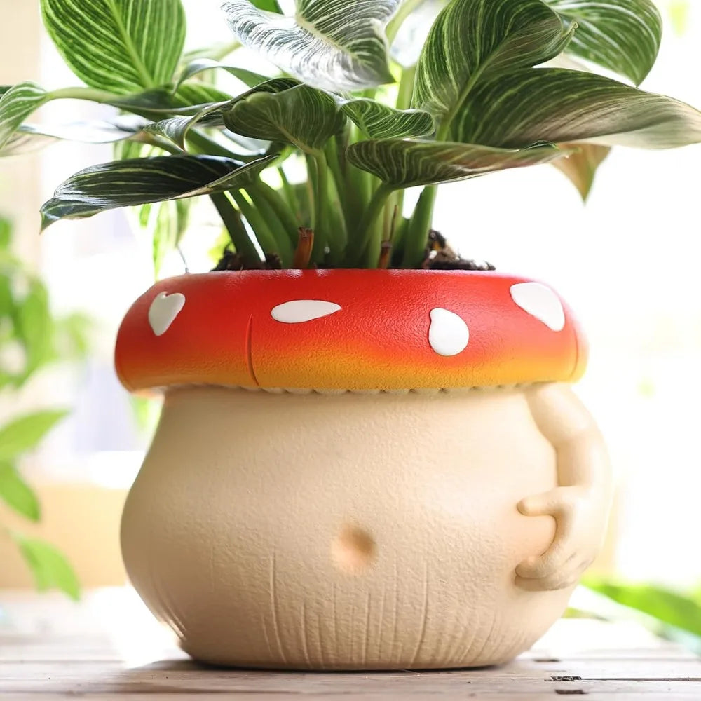 Cute mushroom-shaped planter with a cartoon face on a wooden surface