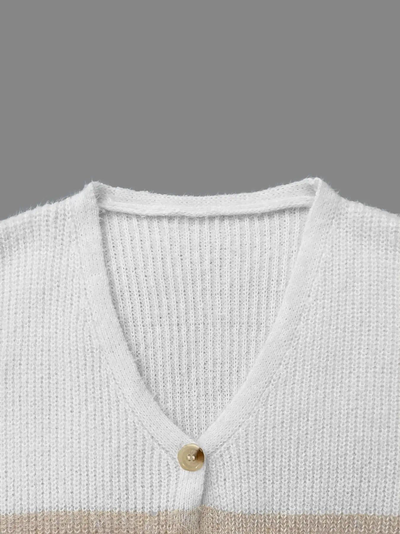 Close-up of a striped sweatercollar line with white, beige, and gray colors on a gray background.