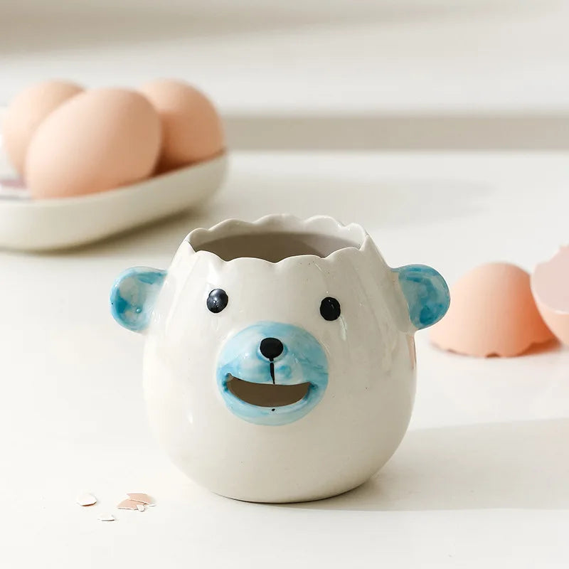 Ceramic bear-shaped container on a light surface with eggs in the background