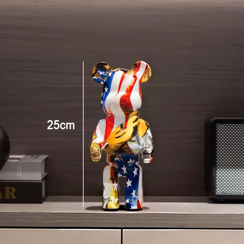 A collectible bear figurine with an American flag and gold chain design, standing on a shelf with a 25cm height measurement overlay.