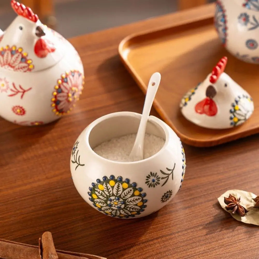 Decorative ceramic containers with floral patterns on a wooden surface