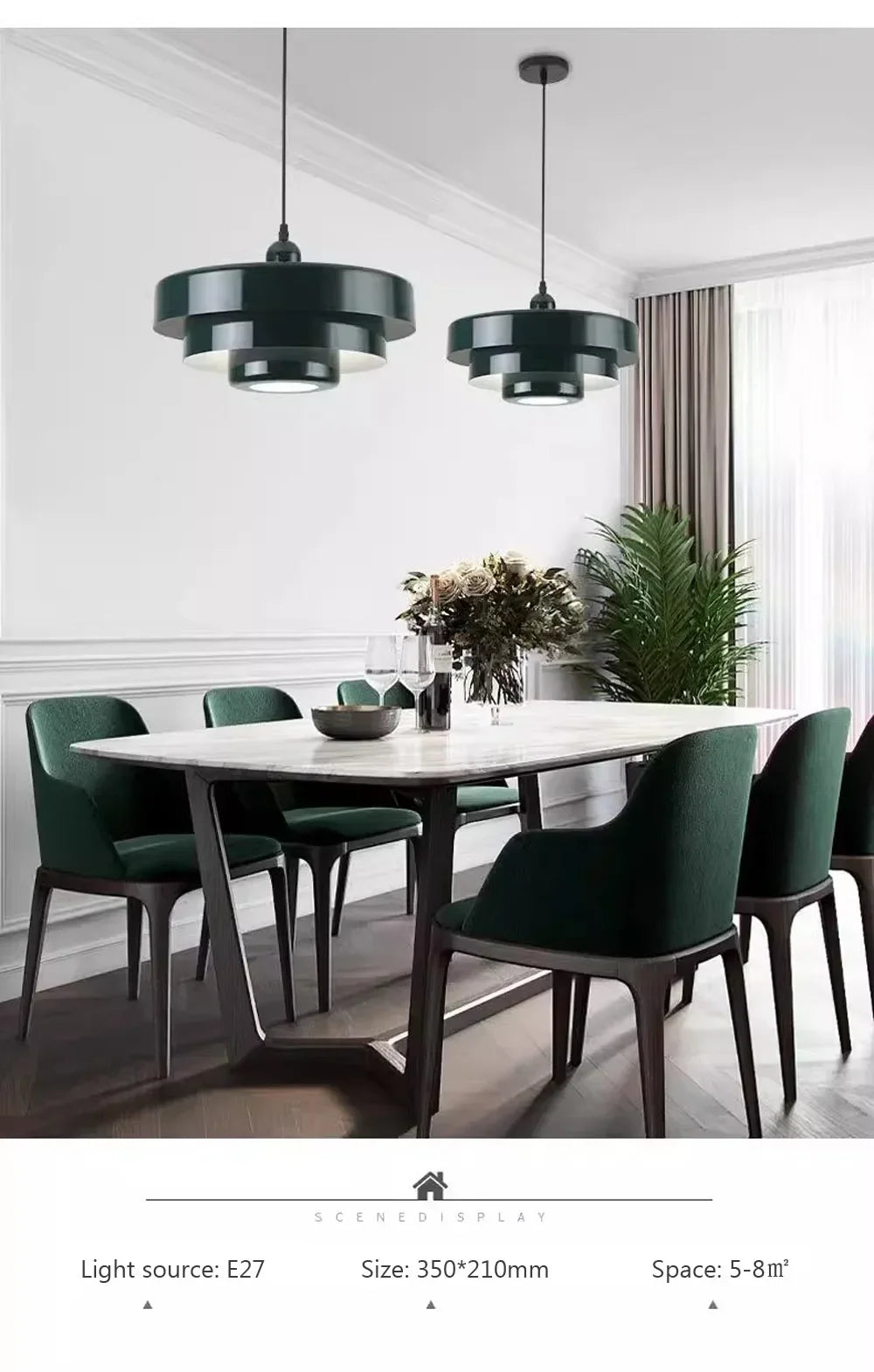 Modern dining room with green chairs and a white table, featuring two black pendant lights.