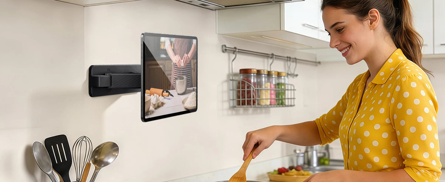 Woman cooking in a kitchen with a digital display showing a recipe.