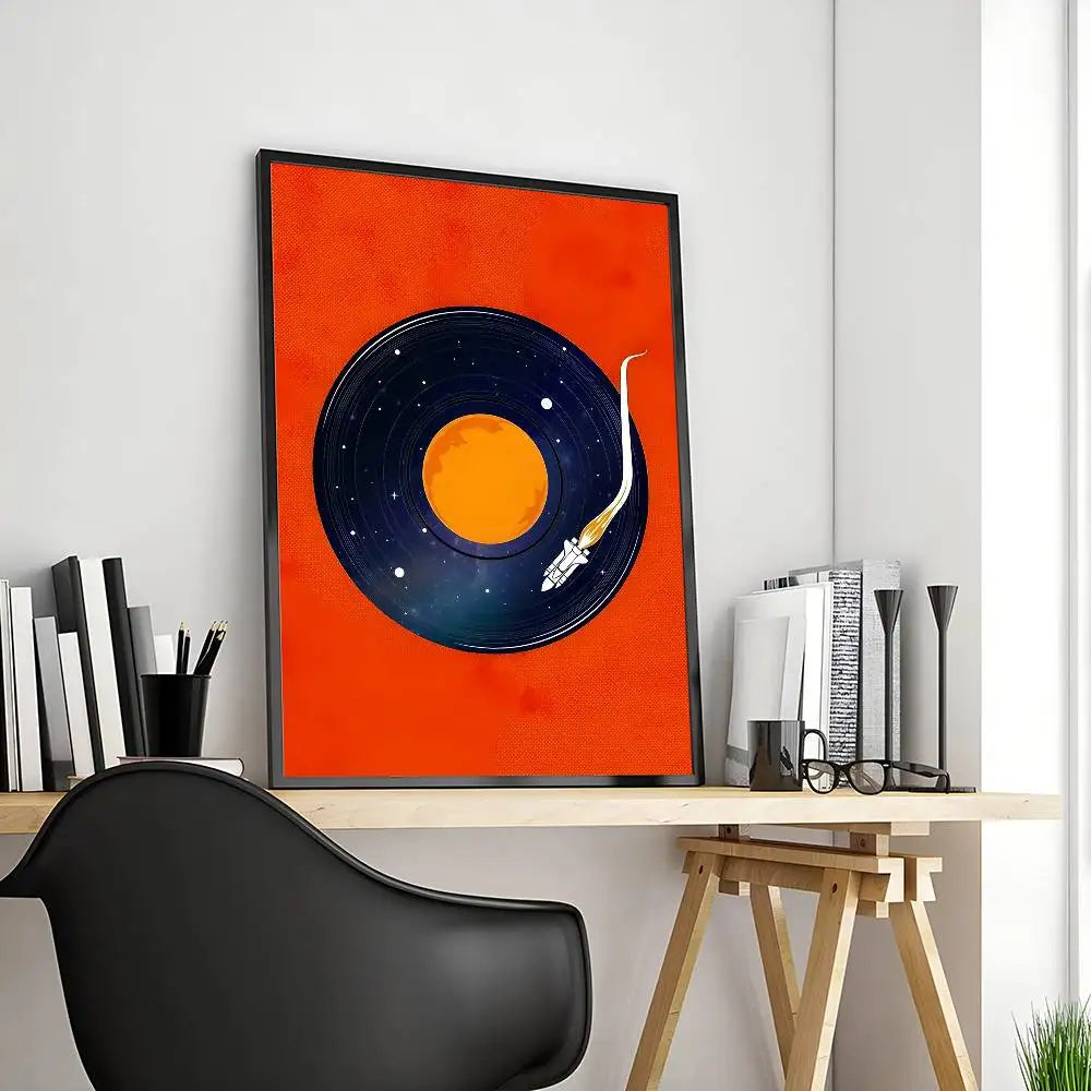 Framed artwork of a vinyl record with space theme on a desk.