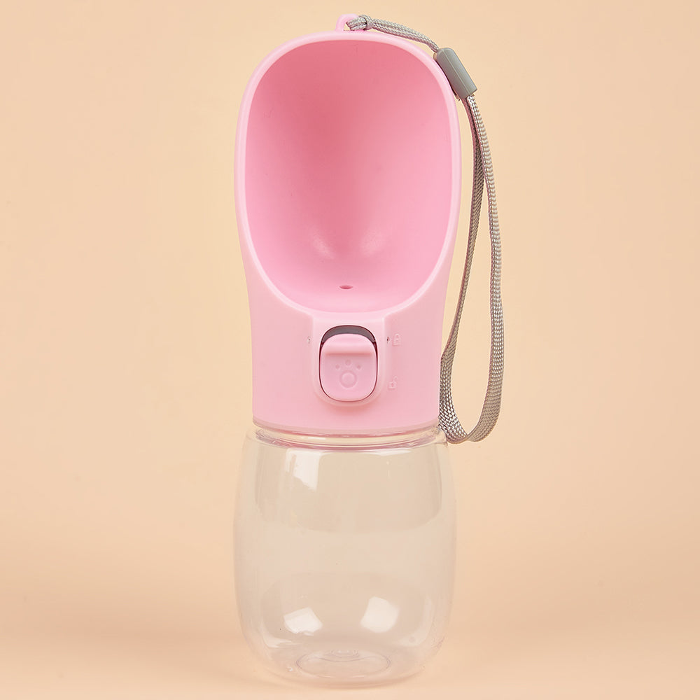 Pink pet water bottle with clear base on a beige background