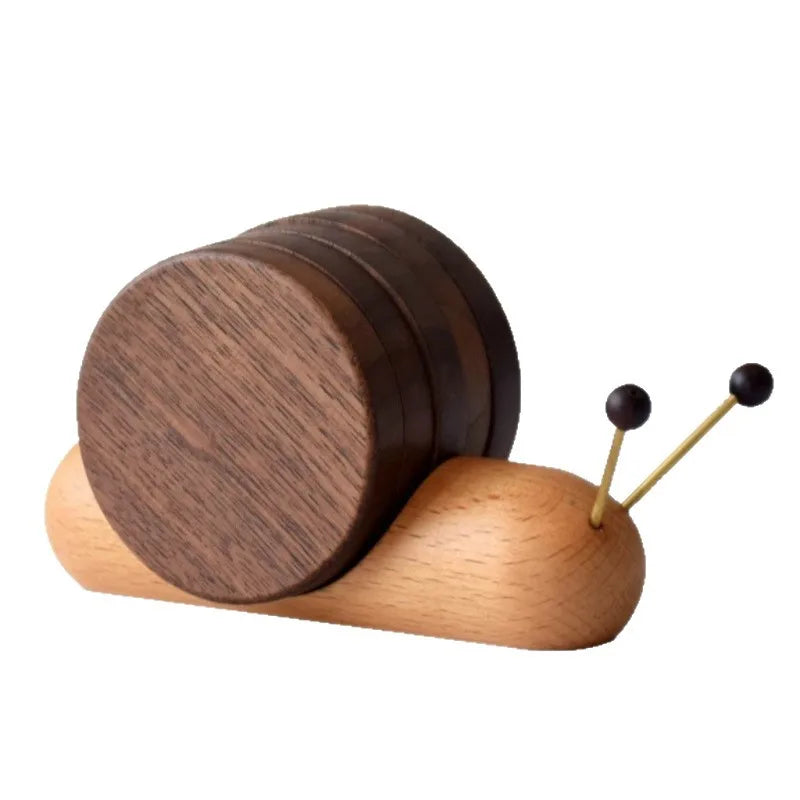 Wooden snail-shaped coast set with a dark brown shell on a white background