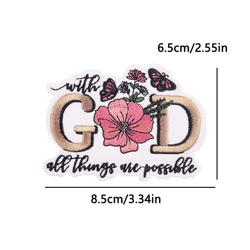 Decorative patch with floral design and text 'with God all things are possible' on a white background.