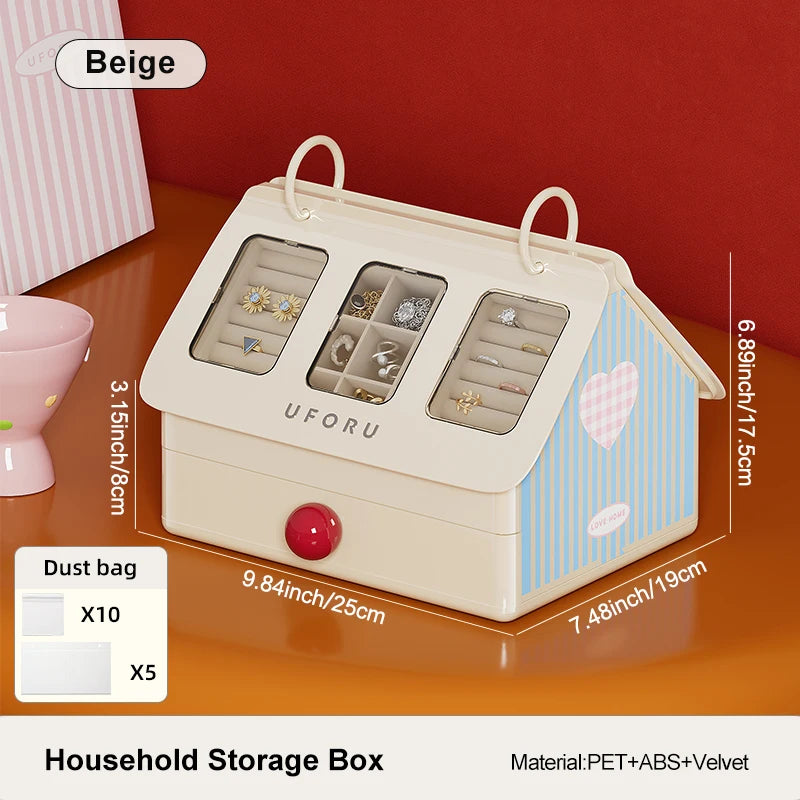 Household storage box with compartments for jewelry on a beige surface