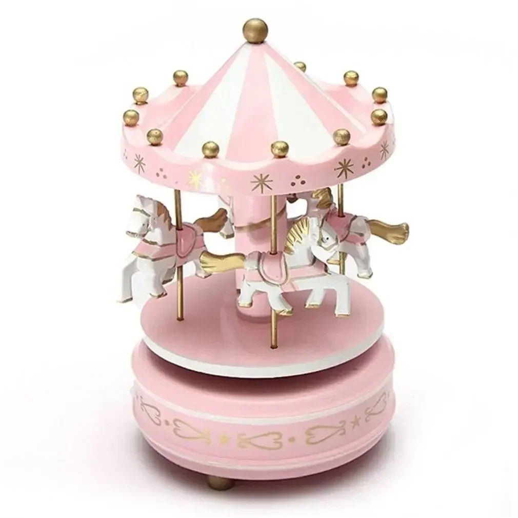 Pink carousel toy with horses on a white background