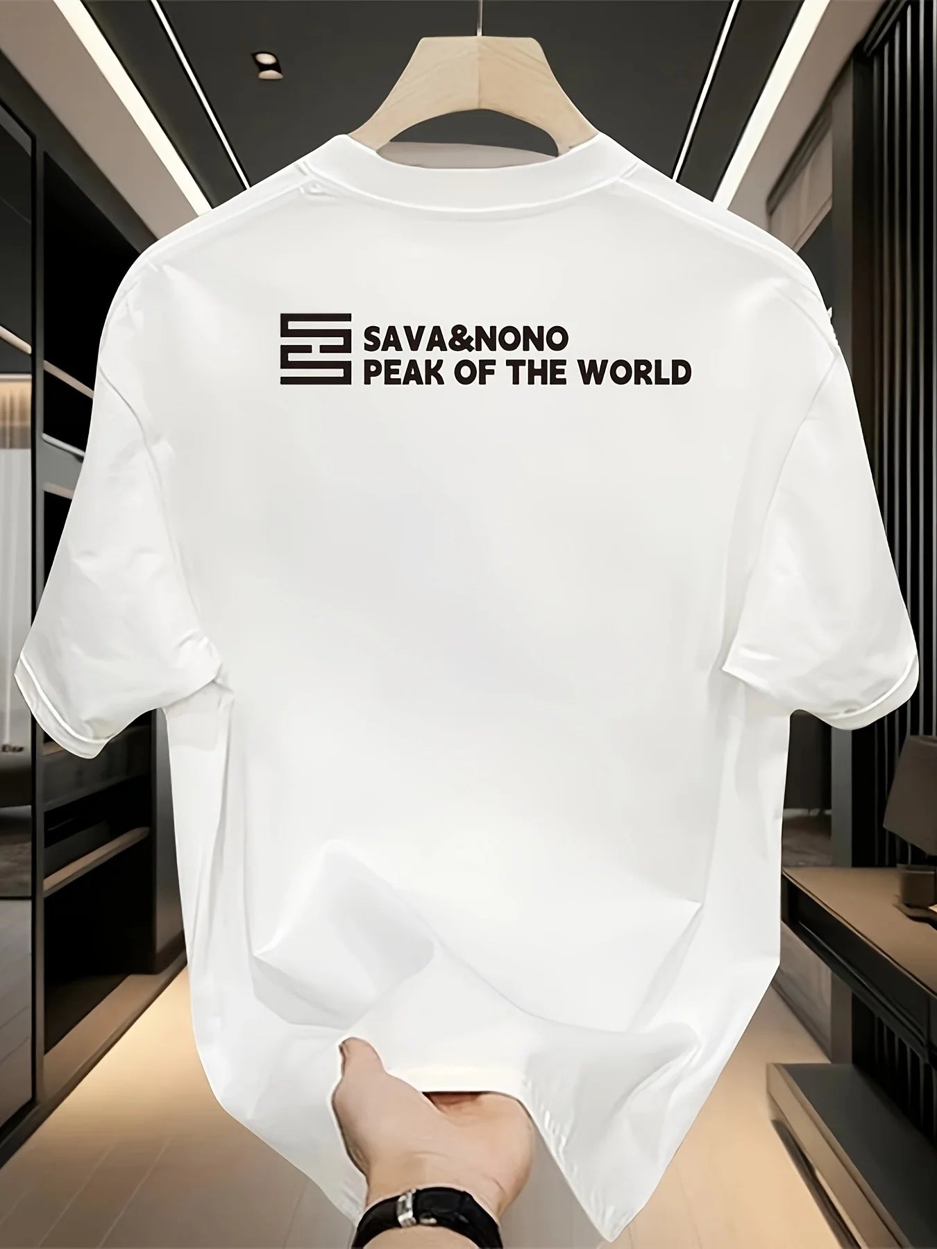 White t-shirt with 'Sava&Nono Peak of the World' logo on a hanger.